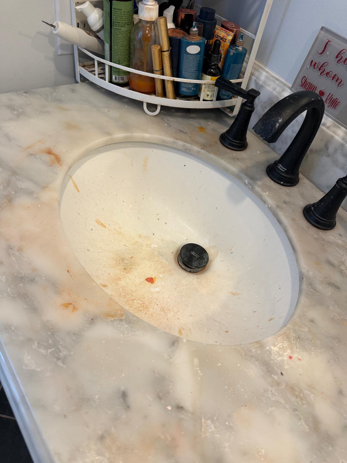 Bathroom sink: stains and residue lifted before cleaning